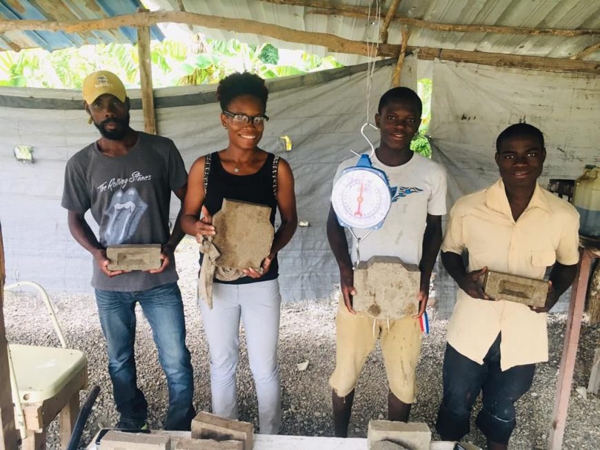 people spreading cement