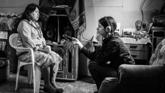 woman holding an audio recorder